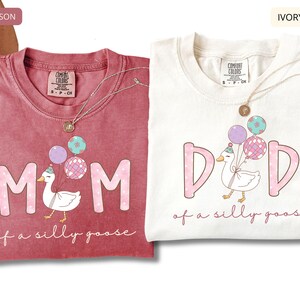 Personalized Comfort Colors mom and dad shirts with cute goose and balloons, funny mom of a silly goose and dad of a silly goose design, pastel graphic tees, parent gift, crimson and ivory color options