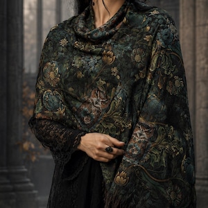 May include: A dark green and black patterned shawl featuring intricate floral and botanical motifs with gold accents and a fringed edge. The fabric displays a rich, multi-colored tapestry design with deep teal, olive, and bronze tones throughout.