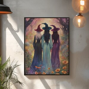 May include: A framed wall art print depicting three figures from behind, each wearing a pointed hat and a long dress in shades of black, light blue, and purple. They stand in a vibrant, colorful forest clearing filled with yellow flowers.