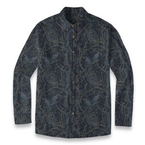 May include: A long-sleeve button-down shirt in a dark navy blue color featuring an all-over print of black birds perched on tangled tree branches with leaves. The shirt includes a front chest pocket, a pointed collar, and light brown buttons.