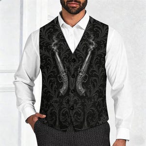 May include: A black vest featuring a dark, intricate damask pattern and a graphic print of two antique flintlock pistols with wisps of smoke rising from the barrels. The vest has a V-neckline and is fastened with four black buttons down the front.