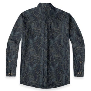 May include: A long-sleeve button-down shirt in a dark navy blue color featuring an all-over print of black birds perched on tangled tree branches with leaves. The shirt has a pointed collar, a buttoned placket, and buttoned cuffs on the sleeves.