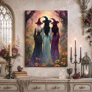 May include: A rectangular wall art print depicting three figures standing with their backs to the viewer in a forest clearing. Each figure wears a long gown and a pointed hat in shades of red, teal, and purple, surrounded by colorful flowers.