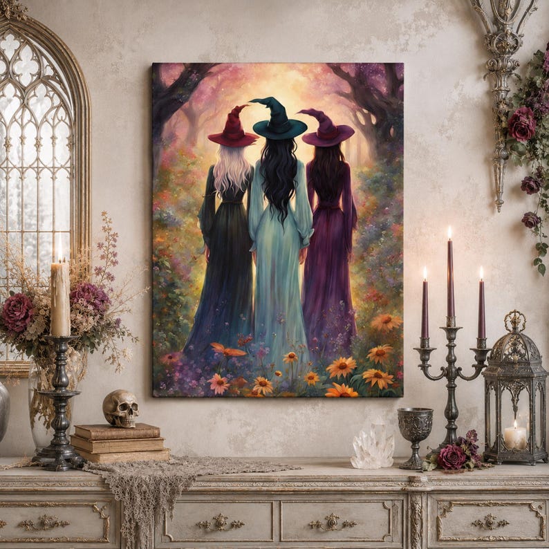 May include: A rectangular wall art print depicting three figures standing with their backs to the viewer in a forest clearing. Each figure wears a long gown and a pointed hat in shades of red, teal, and purple, surrounded by colorful flowers.