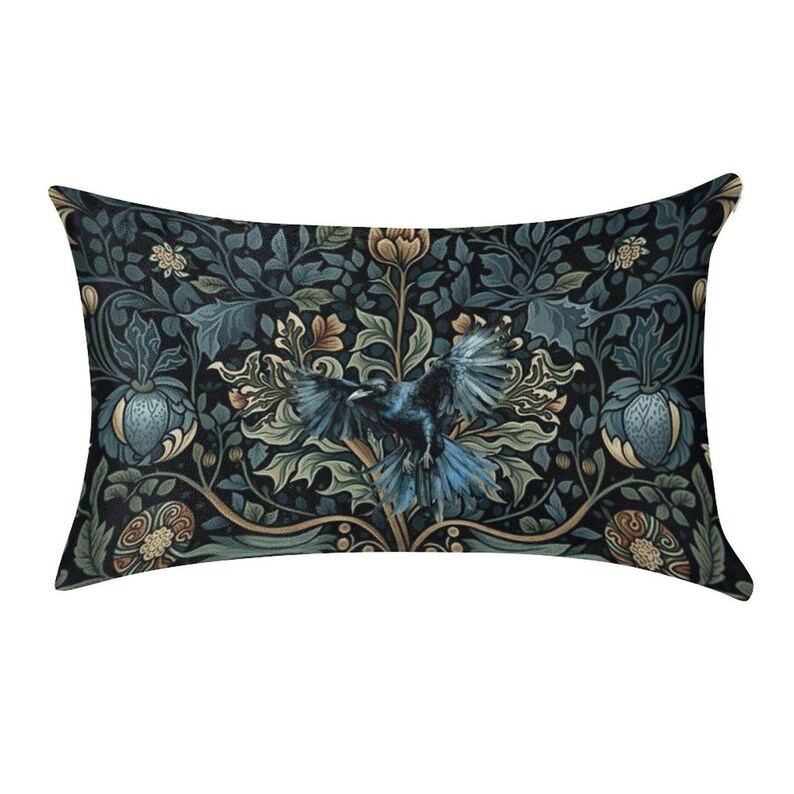 May include: A rectangular throw pillow featuring a dark, intricate botanical pattern with deep blue, green, and muted gold tones. A central black bird with spread wings is surrounded by stylized foliage, leaves, and floral elements.