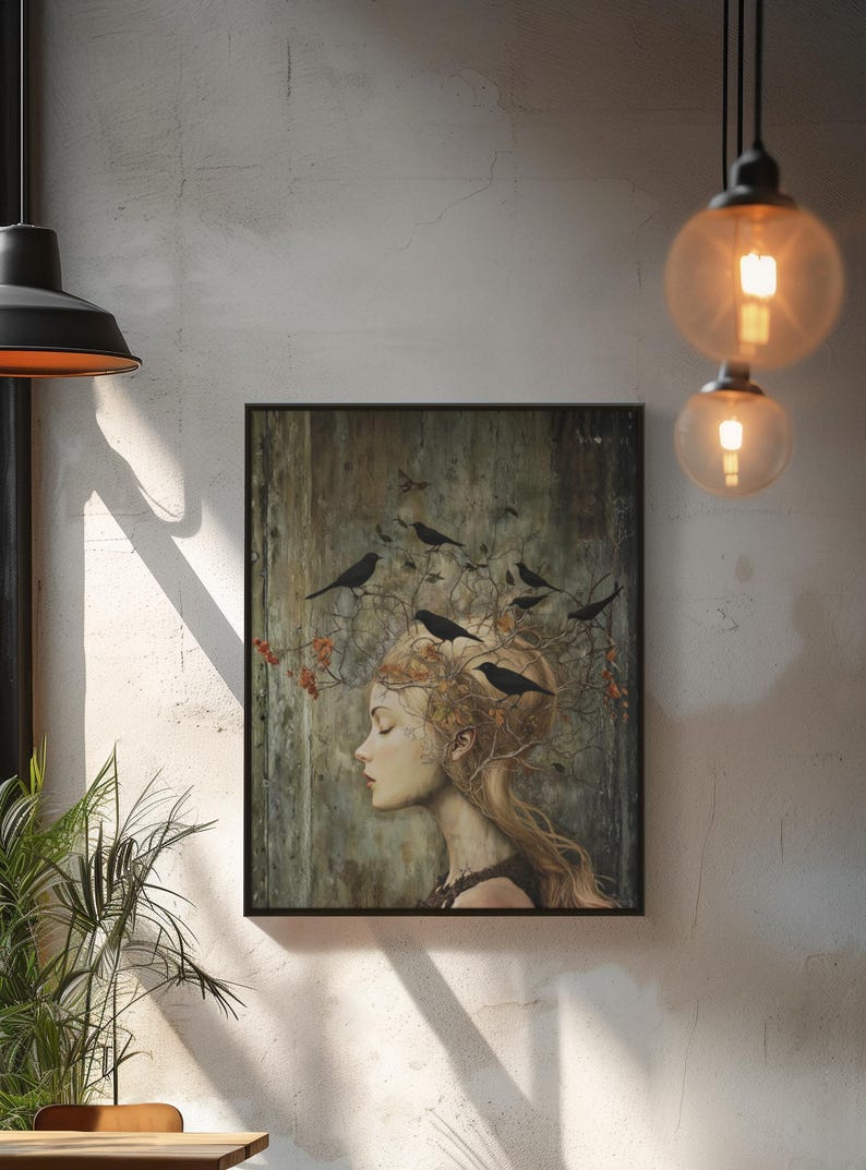 May include: Framed art print featuring a profile of a woman with long blonde hair, adorned with branches, berries, and black birds. The artwork has a muted color palette with a textured background, creating a serene and artistic aesthetic.