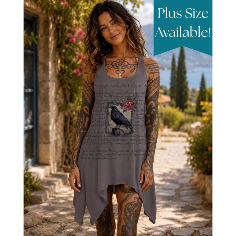 May include: A sleeveless grey tank dress featuring a graphic of a black raven perched on a branch with red flowers, surrounded by cursive script text. The hemline is asymmetrical with pointed edges. The text Plus Size Available is visible.