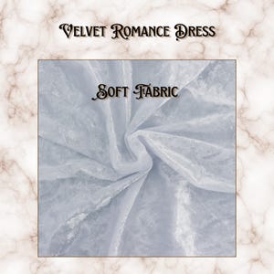 May include: A light gray velvet fabric with a soft, crushed texture. The image features the text "VELVET ROMANCE DRESS" at the top and "SOFT FABRIC" centered over the material, set against a white and brown marble-patterned background.