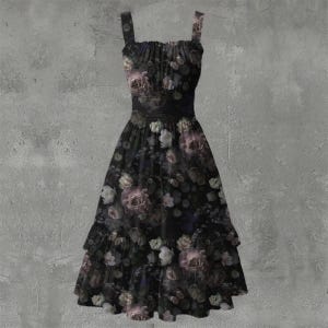 May include: A sleeveless midi dress in a dark black fabric featuring an all-over floral print with muted purple, pink, and white roses. The dress has a gathered bodice, a defined waistline, and a tiered skirt with a ruffled hemline finish.