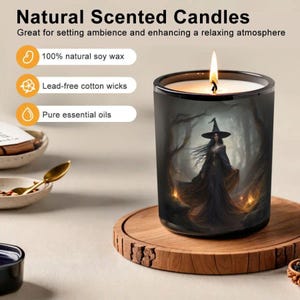 May include: A lit scented candle in a black glass jar with a witch illustration. The candle sits on a wooden coaster. Text on the image reads "Natural Scented Candles" and highlights features like natural soy wax and pure essential oils.