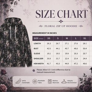 May include: A black zip-up hoodie featuring a floral pattern with white and muted pink roses. The image includes a size chart with measurements in inches for sizes XS through 2XL, detailing length, bust, sleeve, shoulder, and hem width.