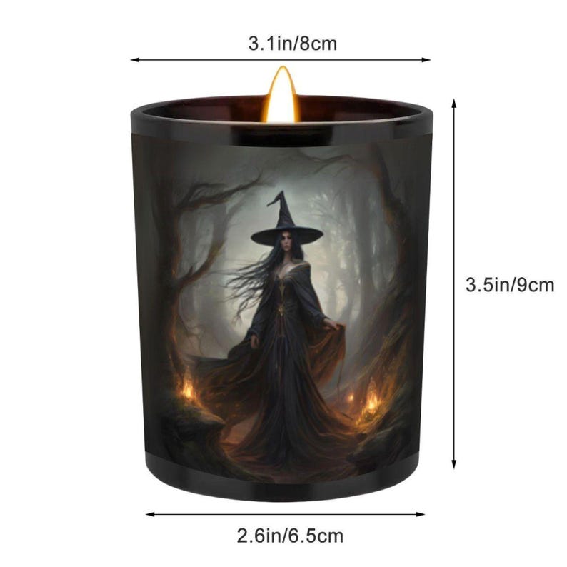 May include: A black candle featuring a witch illustration. The candle measures 9 cm high and 8 cm wide. The witch is depicted in a black dress and hat, set in a forest scene. The candle has a diameter of 6.5 cm.