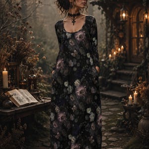 May include: A long-sleeved, floor-length dress featuring a dark black base with a repeating floral pattern in shades of muted purple, grey, and soft green. The garment has a rounded scoop neckline and integrated side pockets for a functional design.