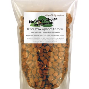 May include: A clear plastic bag filled with raw apricot kernels. The bag has a label that reads "Nature's Choice Supplements" and "Bitter Raw Apricot Kernels". The label also states that the kernels are fresh, high quality, California-grown, all natural, pesticide free, GMO free, gluten free, and vegan. The bag contains 1.25 pounds of kernels, which is approximately 930 kernels.