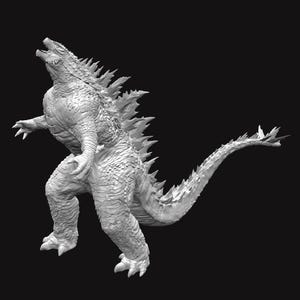 Puede incluir: Una escultura detallada en escala de grises de Godzilla, el icónico monstruo de cine, posa dinámicamente sobre un fondo negro. La figura presenta piel texturizada, aletas dorsales afiladas y una larga cola que se estrecha.