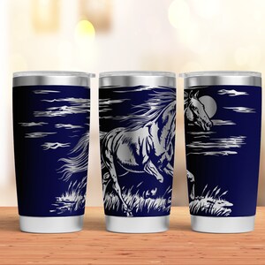 May include: Three stainless steel tumblers with a navy blue background and a silver design of a horse running through a field with clouds and a moon in the background.