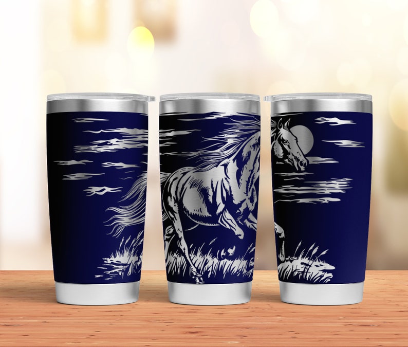 May include: Three stainless steel tumblers with a navy blue background and a silver design of a horse running through a field with clouds and a moon in the background.