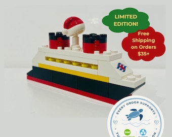 May include: A toy cruise ship constructed from plastic building blocks featuring a white hull, a black midsection, and a red base. The ship has two red smokestacks and a small Santa hat on top. Text includes LIMITED EDITION and Free Shipping.