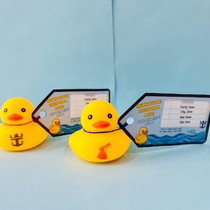 May include: Three yellow rubber duck toys with orange beaks and black eyes. Each duck has a tag that says "Oh what luck you found a duck!" and a place to write information. One duck has a logo on its chest.