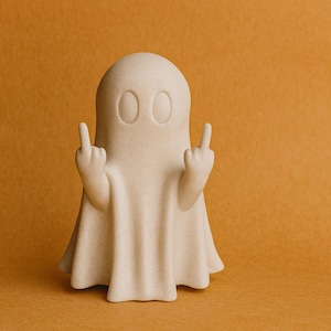 Peut inclure: Figurine de fantôme beige, avec les deux mains faisant un geste obscène, sur fond orange. Le fantôme a des yeux ovales et un corps drapé. Objet décoratif humoristique et original.