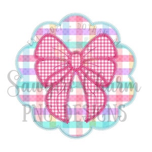 May include: A pink gingham bow with a stitched outline, centered on a colorful plaid background. The background has a scalloped edge and the text "EST 2021 DOTHAN AL" is visible.