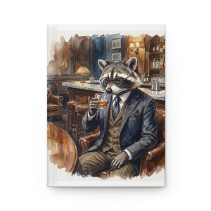 May include: A watercolour illustration of a raccoon in a suit, wearing spectacles, and holding a glass of whisky. The raccoon is seated in a leather chair at a bar. The background features a bar, stools, and a warm, inviting atmosphere.
