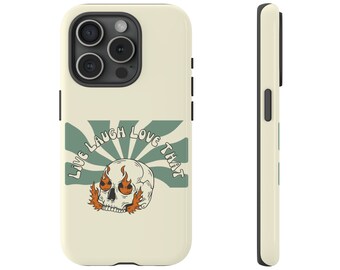 May include: A white phone case with a green and white sunburst design. The design features a skull with flames for eyes and the text "Live Laugh Love That".