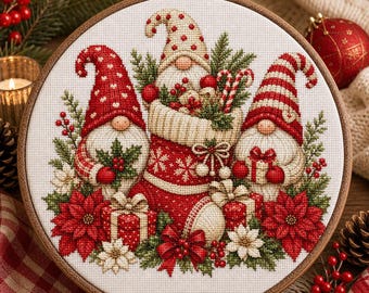 May include: A circular embroidery hoop containing a cross-stitch design of three gnomes. The center gnome sits in a red stocking filled with candy canes. The gnomes wear red and white hats, surrounded by poinsettias, gifts, and greenery.
