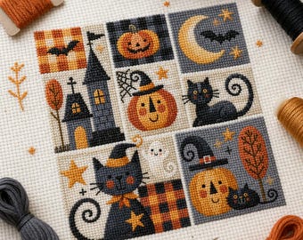 May include: A cross-stitch embroidery pattern on white fabric featuring a grid of Halloween motifs including a haunted house, jack-o'-lanterns, black cats, a crescent moon, bats, and stars, surrounded by several spools of embroidery thread.