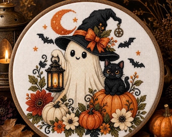 May include: A circular embroidery hoop containing a cross-stitch design of a white ghost wearing a black witch hat with an orange bow, holding a lantern. A black cat sits on an orange pumpkin, surrounded by white and orange flowers and bats.