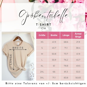 May include: A tan T-shirt displayed on a hanger, with a size chart in centimeters. The chart lists sizes XS to 3XL, with measurements for width, length, and sleeve length. The text "BREITE" and "L&Auml;NGE" are labeled on the shirt.
