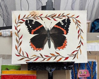 Originale Aquarellillustration | Botanische Kunst | Wohndekoration | Wandbild | Handgefertigt: „Schmetterling in einem Kranz aus Herbstblättern“