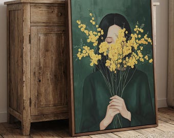 May include: A framed wall art print featuring a person with dark hair wearing a dark green shirt, holding a large bouquet of bright yellow mimosa flowers that obscures their face against a deep forest green background.