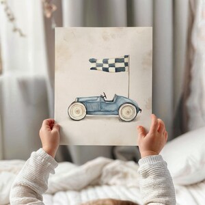 Watercolor vintage race car art for nursery decor — cute and playful visual enhances a transportation theme with soft colors and clean detailing.