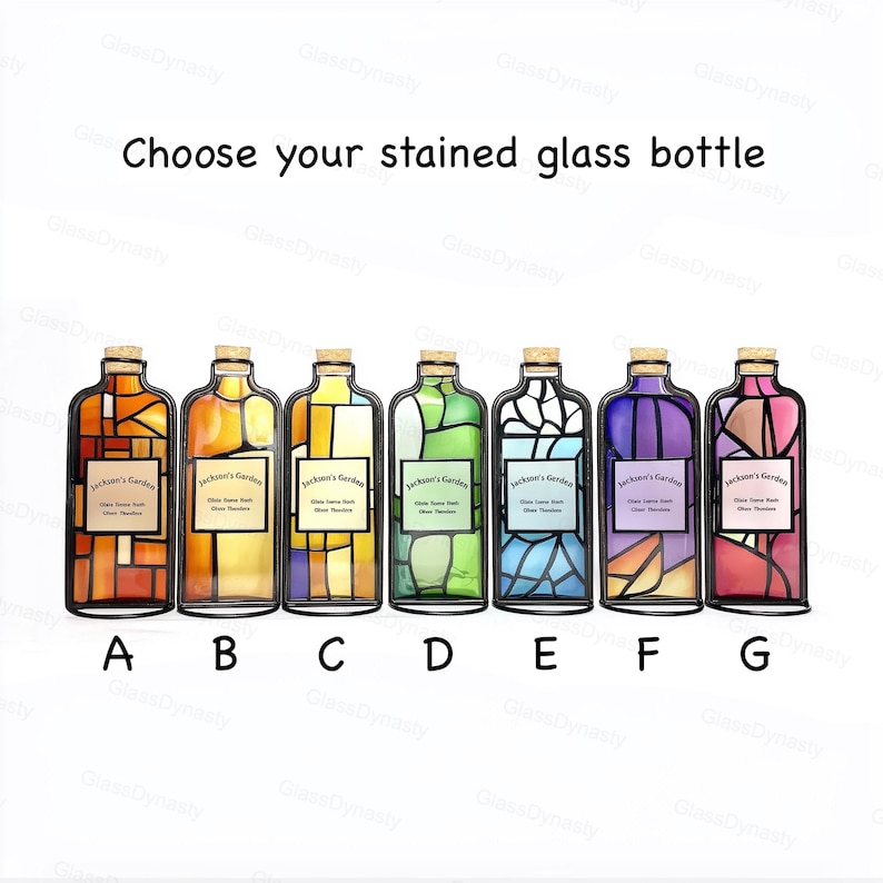 May include: Choose your stained glass bottle. Seven decorative glass bottles with cork stoppers are displayed. Each bottle features a unique stained glass design in various colors, including orange, yellow, green, blue, purple, and pink. Each bottle has a label.