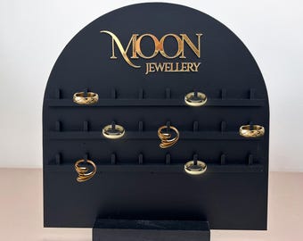 Personalized rings organizer in matte black acrylic with hooks and gold text