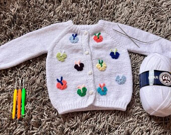 Embroidered knitted butterfly patterned baby cardigan/vest/jacket/sweater, white patterned outfit for newborn babies or children.