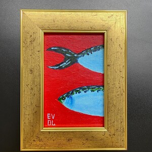 May include: A framed painting of two blue fish on a red background. The fish have detailed scales and are set against a vibrant red backdrop. The frame is gold-colored, adding a touch of elegance to the artwork. The painting is signed with the initials "EV DL".