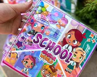 May include: A spiral-bound notebook with a clear plastic cover featuring colorful cartoon illustrations and the text "SCHOOL AVATAR WORLD". The notebook has a pink border and a variety of cartoon characters.