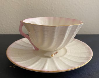 Belleek Neptune pink seashell cup and saucer