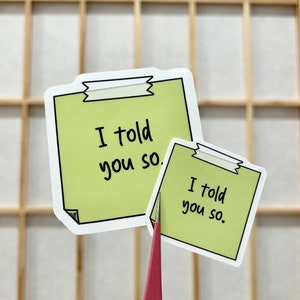 May include: Two green sticky note stickers with the text "I told you so" written in black marker.
