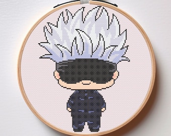 May include: Cross stitch pattern of a cartoon character with spiky white hair, wearing a black eye mask and a dark blue jumpsuit. The character is in a circular embroidery hoop.