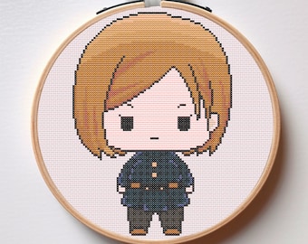 May include: A cross-stitch pattern of a cartoon character with short brown hair, wearing a dark blue jacket with gold buttons and black pants. The character is standing on a white background.
