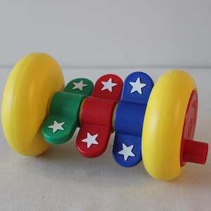 1980s Johnson & Johnson Spin-a-Sound interactive rattle toy