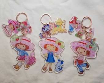 Llaveros grandes con múltiples dijes de Strawberry Shortcake y sus amigos