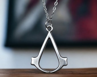 Assassin's C. Necklace - Symbol of Stealth and Adventure - Gaming Jewelry for the Brotherhood -  Gift for Video Game Enthusiasts