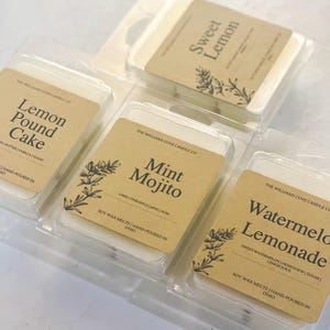 May include: A collection of soy wax melts in clear plastic packaging. Each melt has a brown label with a botanical illustration and the scent name: Lemon Pound Cake, Mint Mojito, Watermelon Lemonade, and Sweet Lemon. The text "Hand-poured in Ohio" is also visible.