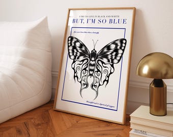 May include: A black and white illustration of a butterfly with intricate details. The text "I try to live in black and white BUT, I'M SO BLUE" is printed above the butterfly. The text "You were born to be a butterfly" is printed below the butterfly. The text "Beautiful and so deprived of oxygen" is printed below the butterfly.