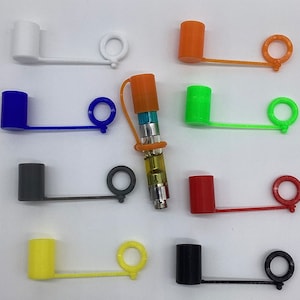 May include: Assortment of colorful silicone caps with a loop for attaching to a vape pen. The caps are in various colors, including blue, green, orange, red, black, white, and gray.