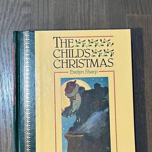 Könnte beinhalten: Ein Vintage-Hardcover-Buch mit dem Titel "The Child's Christmas" von Evelyn Sharp, illustriert in Farbe von Charles Robinson. Der Umschlag zeigt eine farbenfrohe Illustration des Weihnachtsmanns mit rotem Hut und Mantel, der in einen Kamin schaut.